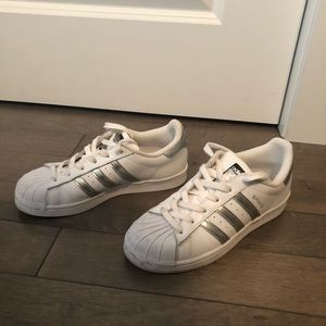 White and silver  adidas superstars